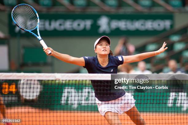 June 10. French Open Tennis Tournament - Day Fifteen. Makoto Ninomiya of Japan in action with her doubles partner Eri Hozumi of Japan against Barbora...