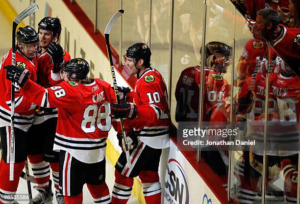 Niklas Hjalmarsson, Brent Sopel, Patrick Kane and Patrick Sharp of the Chicago Blackhawks celebrate Kanes' goal in the third period against the...