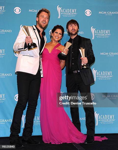 Musician Charles Kelley, singers Hillary Scott, and Dave Haywood of the band Lady Antebellum, winner of Song of the Year, pose in the press room...