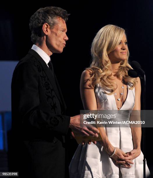 Musician Randy Travis and singer Carrie Underwood present the Top Vocal Duo award onstage during the 45th Annual Academy of Country Music Awards at...