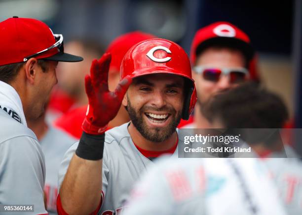 Jose Peraza of the Cincinnati Reds celebrates a home run with teammates in the third inning of an MLB game against the Atlanta Braves at SunTrust...
