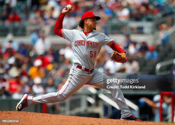 Luis Castillo of the Cincinnati Reds pitches in the third inning of an MLB game against the Cincinnati Reds at SunTrust Park on June 27, 2018 in...