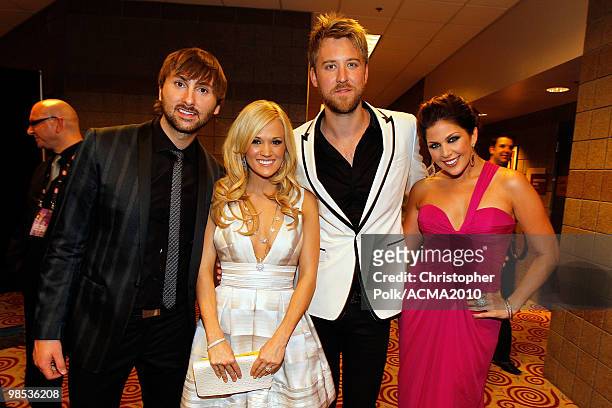 Musician Dave Haywood, singers Carrie Underwood, Charles Kelley, and Hillary Scott pose backstage at the 45th Annual Academy of Country Music Awards...