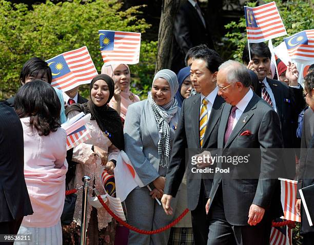 Malaysian Prime Minister Najib Tun Razak smiles with Japanese Prime Minister Yukio Hatoyama during the welcoming ceremony at Hatoyama's official...