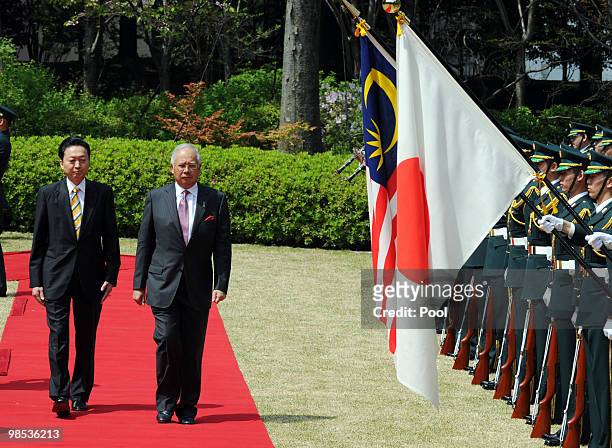 Malaysian Prime Minister Najib Tun Razak reviews the honour guard with Japanese Prime Minister Yukio Hatoyama during his welcoming ceremony at...