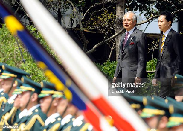 Malaysian Prime Minister Najib Tun Razak walks with Japanese Prime Minister Yukio Hatoyama to attend the welcoming ceremony at Hatoyama's official...