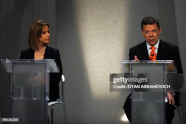 Presidential candidate Noemi Sanin of the Conservative Party listens as former Defence Minister Juan Manuel Santos and presidential candidate for the...