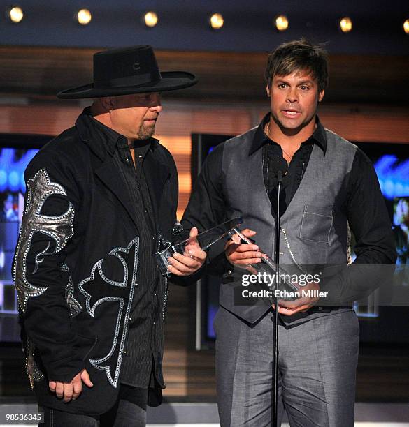 Musicians Eddie Montgomery and Troy Gentry accept the Home Depot Humanitarian award onstage during the 45th Annual Academy of Country Music Awards at...