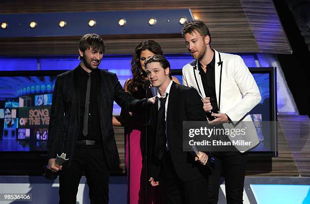 Musicians Dave Haywood, Hillary Scott, writer Josh Kear, and Charles Kelley of the band Lady Antebellum accept the Song Of The Year award during the...