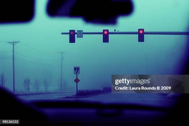 street on a rainy day from a car - car red light stock pictures, royalty-free photos & images