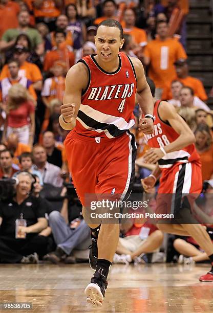 Jerryd Bayless of the Portland Trail Blazers pumps his fist after teammate Nicolas Batum hit a three point shot against the Phoenix Suns during Game...