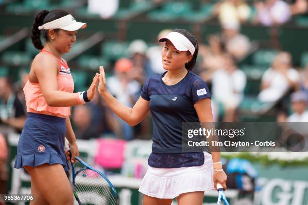 June 10. French Open Tennis Tournament - Day Fifteen. Eri Hozumi of Japan in action with her doubles partner Makoto Ninomiya of Japan against Barbora...