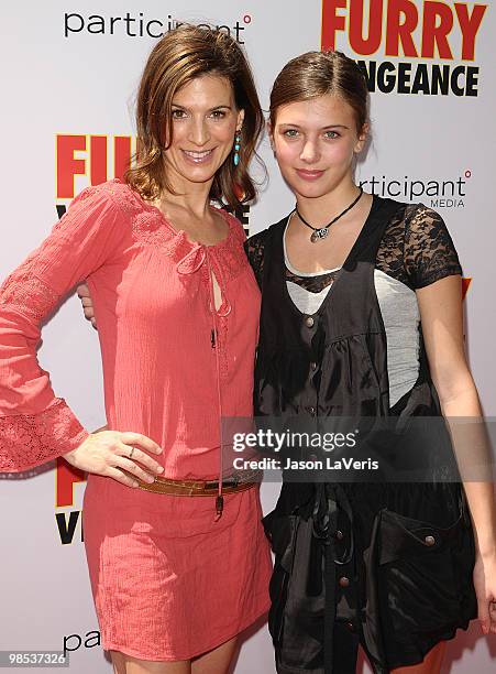 Actress Perrey Reeves and guest attend the premiere of "Furry Vengeance" at Mann Bruin Theatre on April 18, 2010 in Westwood, California.