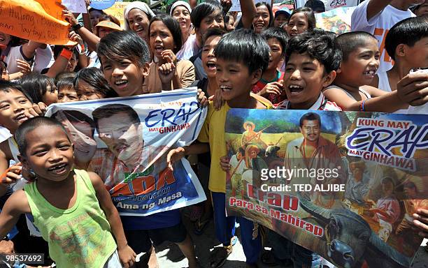 Young supporters of former president and now presidenTial candidate Joseph Estrada chant his nickname "Erap" as they wait for his arrival to...
