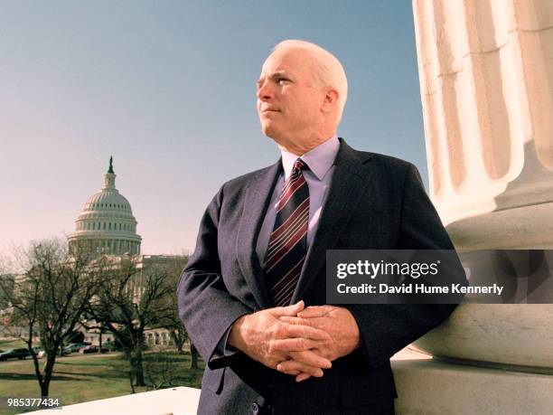 Senator John McCain stands at the Russell Senate Office Building with the US Capitol in the background, Washington, DC, January 20, 2000.