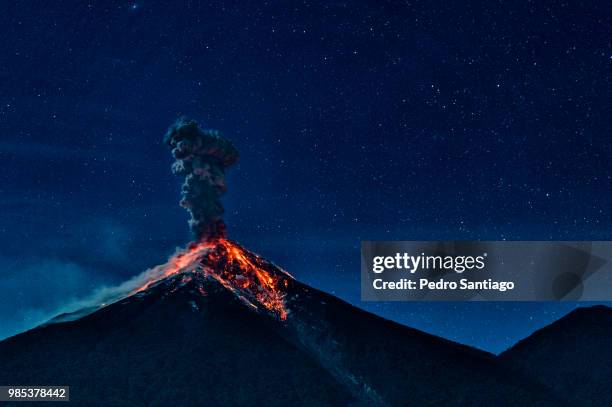an erupting volcano in alotenango, guatemala. - volcano eruption stock pictures, royalty-free photos & images