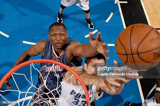 Theo Ratliff of the Charlotte Bobcats competes for a rebound against Ryan Anderson of the Orlando Magic in Game One of the Eastern Conference...