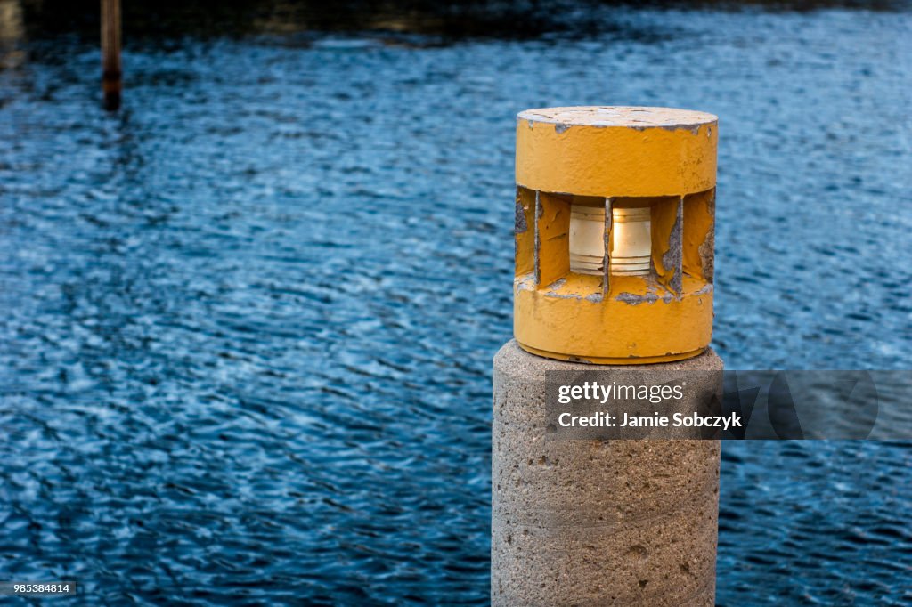 Yellow Lightpost Blue Water