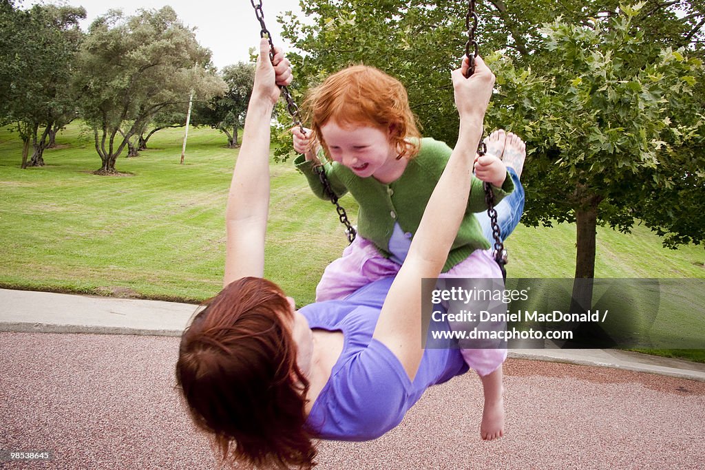 Mother & Daughter Swinging Together
