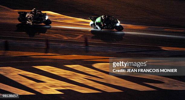 French Gregory Leblanc rides his Kawasaki N°11 ahead of French Gwen Giabbani on his Yamaha N°1 during the 33rd edition of the Le Mans 24-Hour...