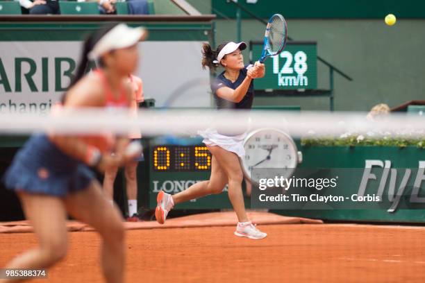 June 10. French Open Tennis Tournament - Day Fifteen. Makoto Ninomiya of Japan in action with her doubles partner Eri Hozumi of Japan against Barbora...
