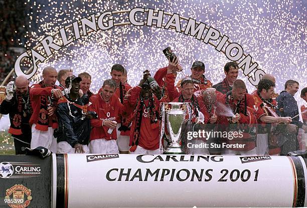 Manchester United celebrate winning the FA Carling Premiership trophy after the match between Manchester United and Derby County at Old Trafford,...