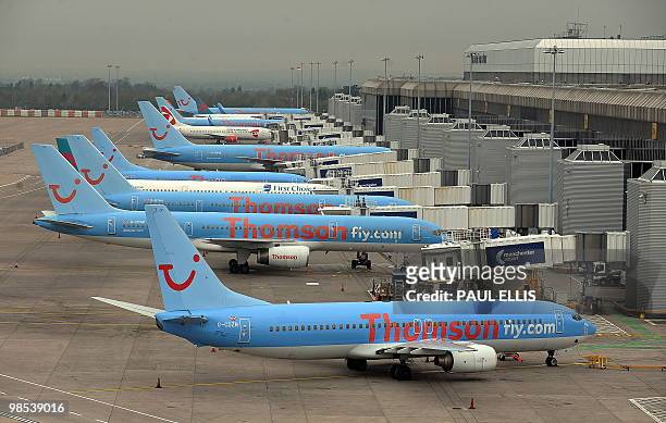Grounded aircraft are pictured on the apron at Manchester Airport in north-west England, on April 19, 2010. Britain is dispatching Navy ships to help...