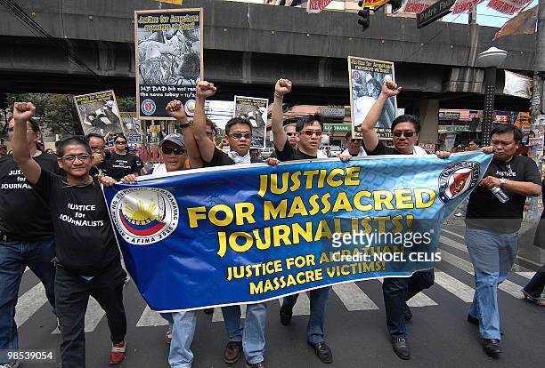 Group of journalist demand justice for 57 Amputuan massacre victims in Maguindanao, during a rally in front of the Department of Justice building in...