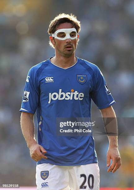 Tommy Smith of Portsmouth wears a protective mask during the Barclays Premier League match between Portsmouth and Aston Villa at Fratton Park on...