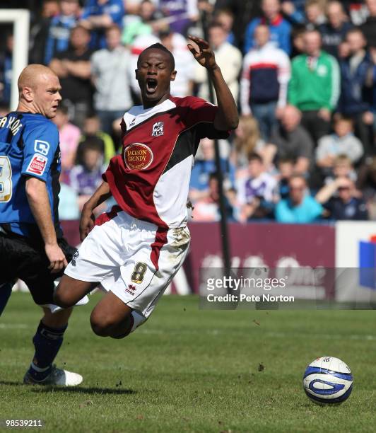 Abdul Osman of Northampton Town is fouled by Jason Taylor of Rochdale during the Coca Cola League Two Match between Rochdale and Northampton Town at...
