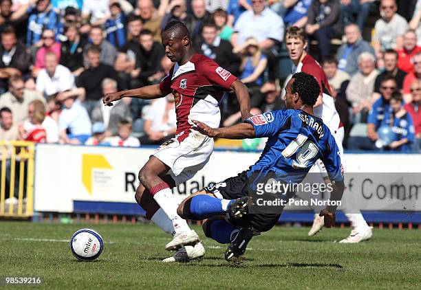 Abdul Osman of Northampton Town looks to play the ball under pressure from Chris O'Grady of Rochdale during the Coca Cola League Two Match between...