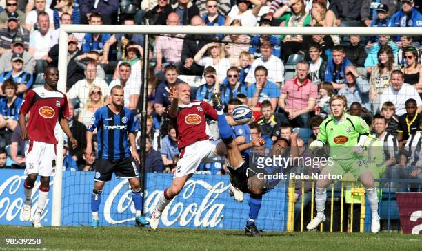 Chris O'Grady of Rochdale attempts an overhead kick under pressure from Andy Holt of Northampton Town during the Coca Cola League Two Match between...