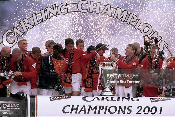 Manchester United celebrate winning the FA Carling Premiership trophy after the match between Manchester United and Derby County at Old Trafford,...