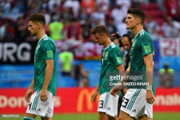 Germany's team players react at the end of the Russia 2018 World Cup Group F football match between South Korea and Germany at the Kazan Arena in...