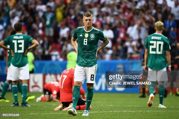 Germany's forward Thomas Mueller, Germany's midfielder Toni Kroos and Germany's forward Julian Brandt react after South Korea's forward Son Heung-min...