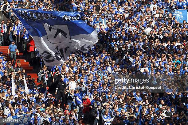 The fans of Schalke wave a flag during the Bundesliga match between FC Schalke 04 and Borussia Moenchengladbach at the Veltins Arena on March 17,...