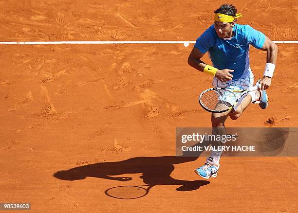 Spain's Rafael Nadal runs before hitting a return to his compatriot Fernando Verdasco during the Monte-Carlo ATP Masters Series Tournament tennis...