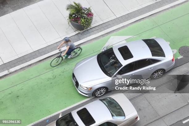 June 21: Pedestrians, cyclists and motorists all trying to navigate the complicated and confusing intersection of Bay Street and Richmond Street West.