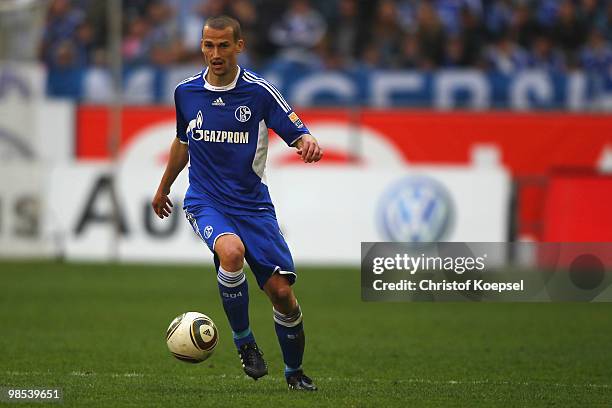 Peer Kluge of Schalke runs runs with the ball during the Bundesliga match between FC Schalke 04 and Borussia Moenchengladbach at the Veltins Arena on...