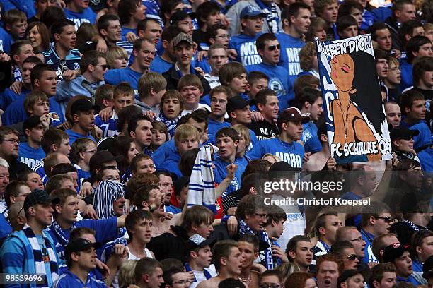 Schalke fans are seen in the stadium during the Bundesliga match between FC Schalke 04 and Borussia Moenchengladbach at the Veltins Arena on March...