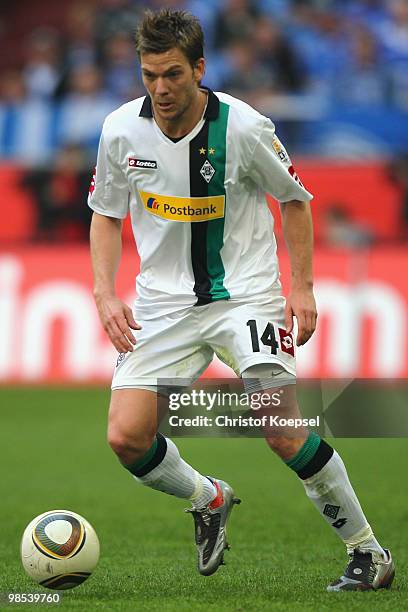 Thorben Marx of Gladbach runs with the ball during the Bundesliga match between FC Schalke 04 and Borussia Moenchengladbach at the Veltins Arena on...