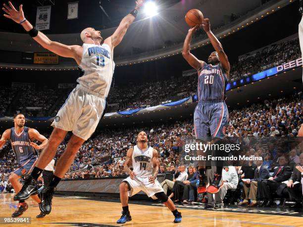 Raymond Felton of the Charlotte Bobcats shoots against Marcin Gortat of the Orlando Magic in Game One of the Eastern Conference Quarterfinals during...