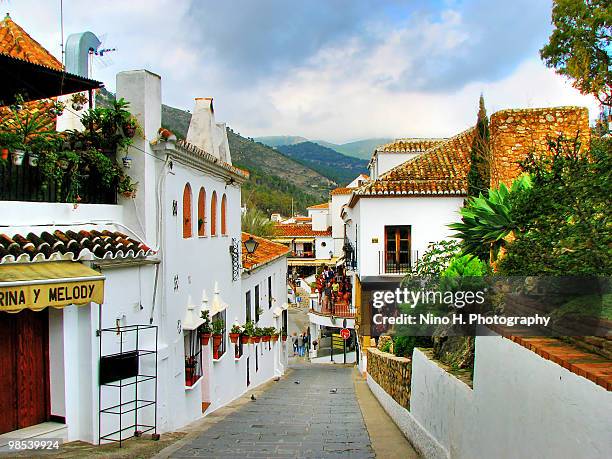 steep street in the village mijas - spain - mijas imagens e fotografias de stock