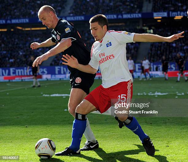 Tunay Torun of Hamburg is challenged by Miroslav Karhan of Mainz during the Bundesliga match between Hamburger SV and FSV Mainz 05 at HSH Nordbank...