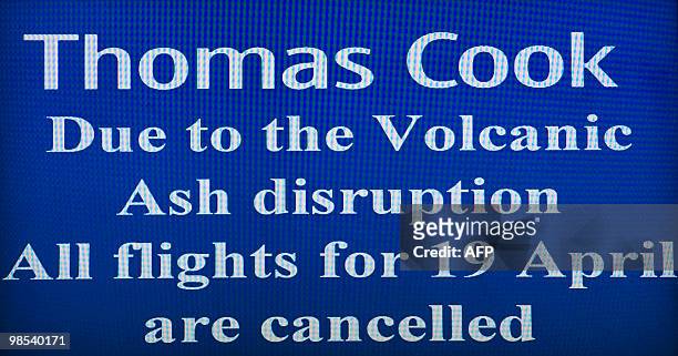 Sign advising passengers of low cost airline Thomas Cook that all flights are cancelled is pictured at Gatwick airport in southern England, on April...