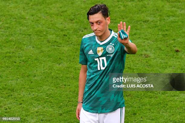 Germany's midfielder Mesut Ozil reacts at the end of the Russia 2018 World Cup Group F football match between South Korea and Germany at the Kazan...