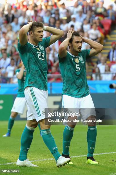 Mats Hummels of Germany and his team mate Mario Gomez react during the 2018 FIFA World Cup Russia group F match between Korea Republic and Germany at...