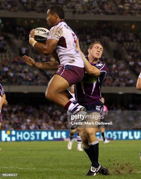 Tony Williams of the Sea Eagles is tackled by Ryan Hoffman of the Storm during the round six NRL match between the Melbourne Storm and the Manly Sea...