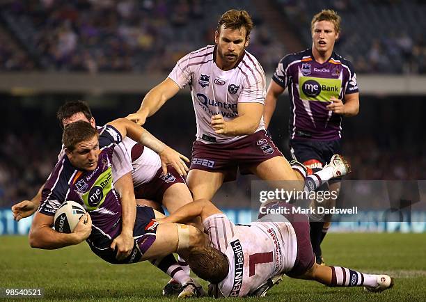 Ryan Hoffman of the Storm is tackled during the round six NRL match between the Melbourne Storm and the Manly Sea Eagles at Etihad Stadium on April...