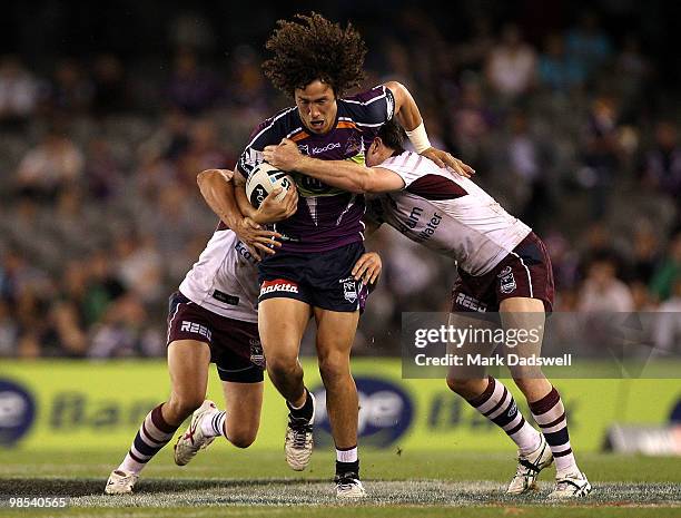 Kevin Proctor of the Storm is tackled during the round six NRL match between the Melbourne Storm and the Manly Sea Eagles at Etihad Stadium on April...